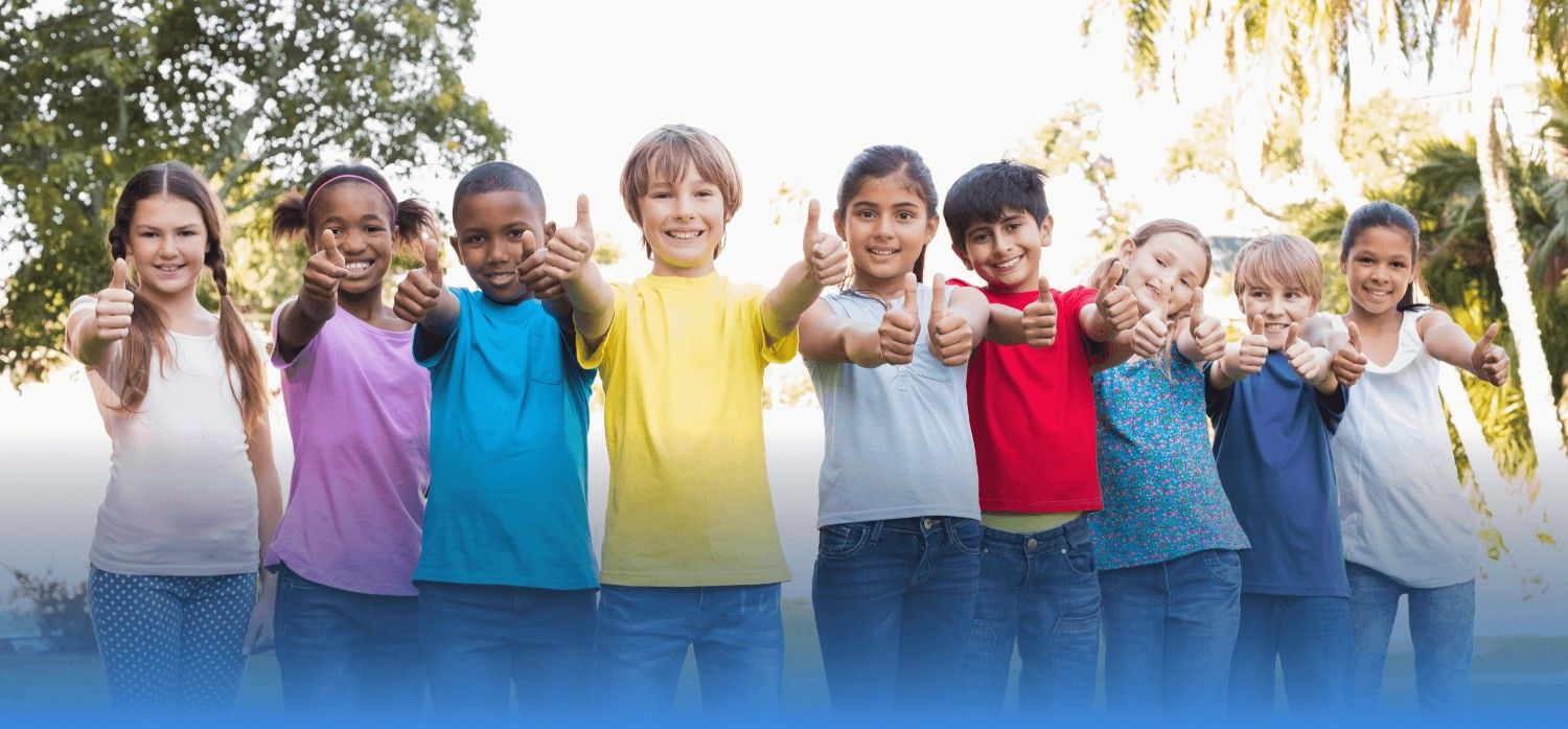 Happy students giving thumbs up
